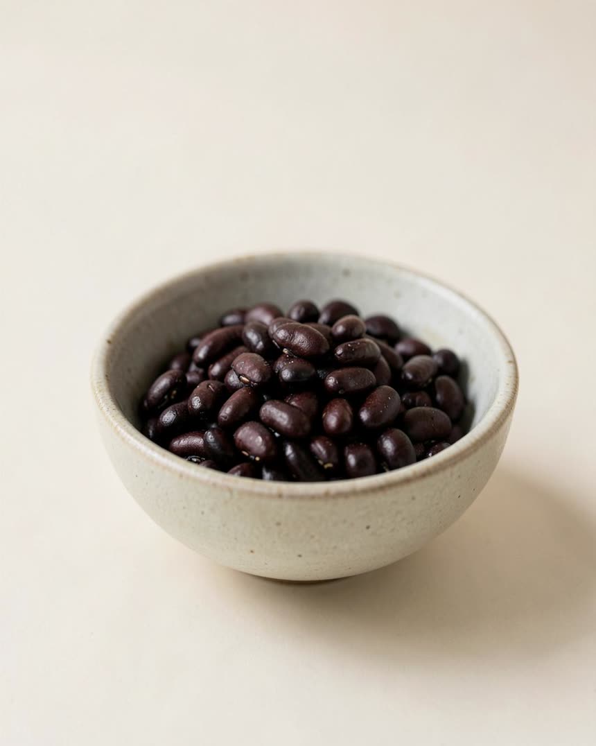 Black beans, canned on a light neutral background