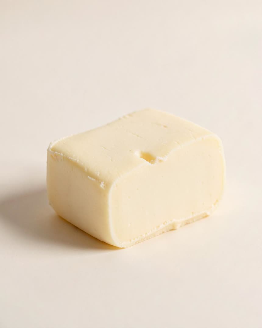 Butter on a light neutral background