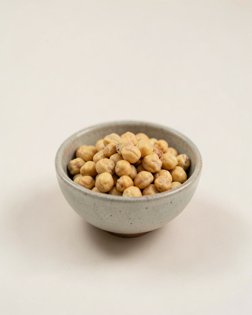 Chickpeas, cooked from dry on a light neutral background