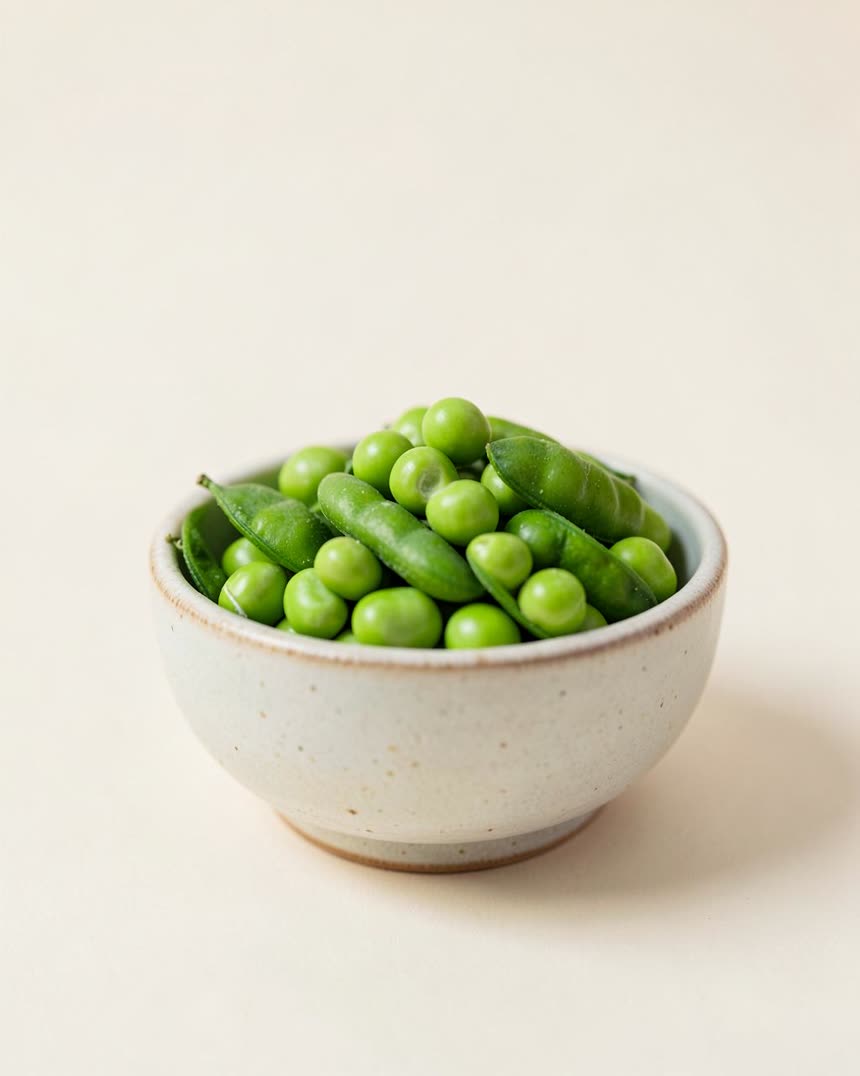 Green peas on a light neutral background
