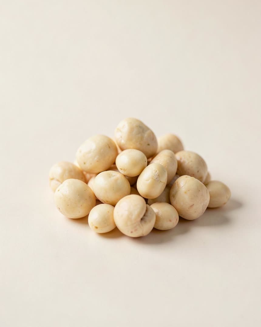 Macadamia nuts on a light neutral background