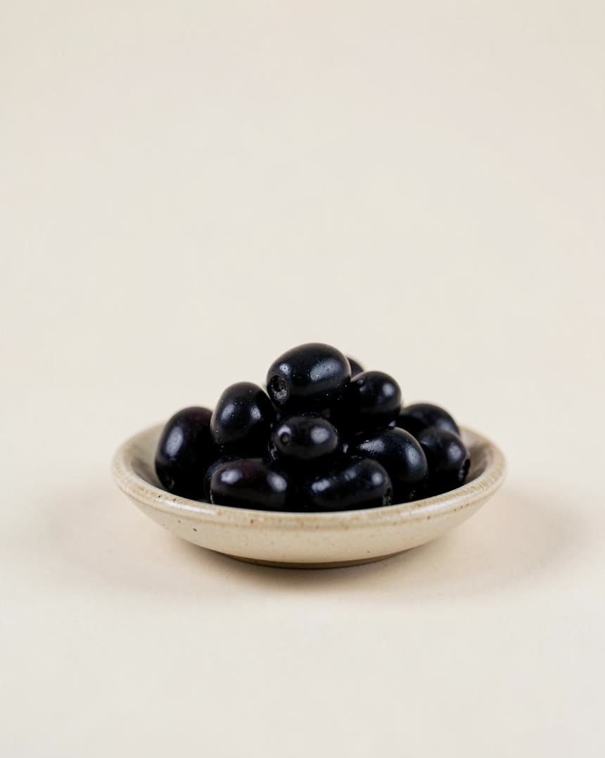 Olives, black on a light neutral background