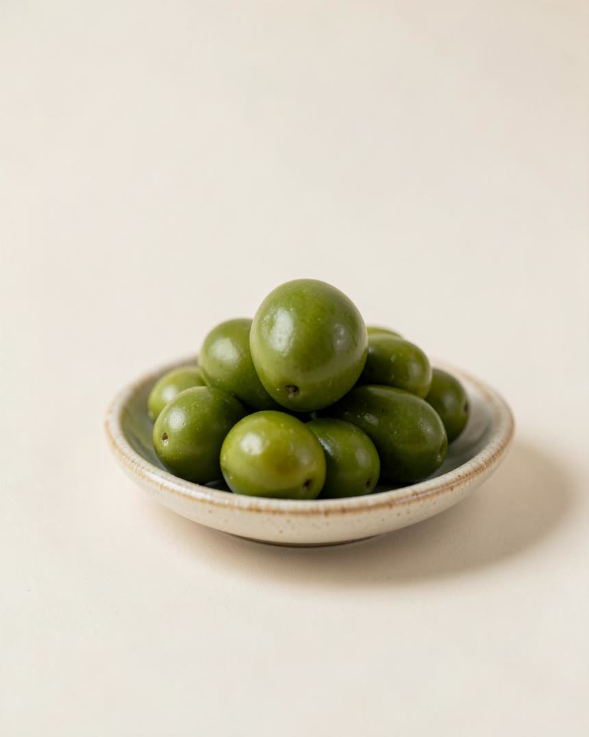 Olives, green on a light neutral background
